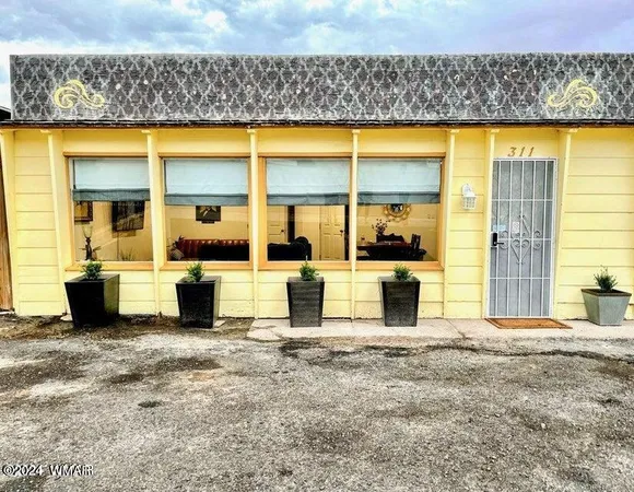 a kitchen with a table and chairs