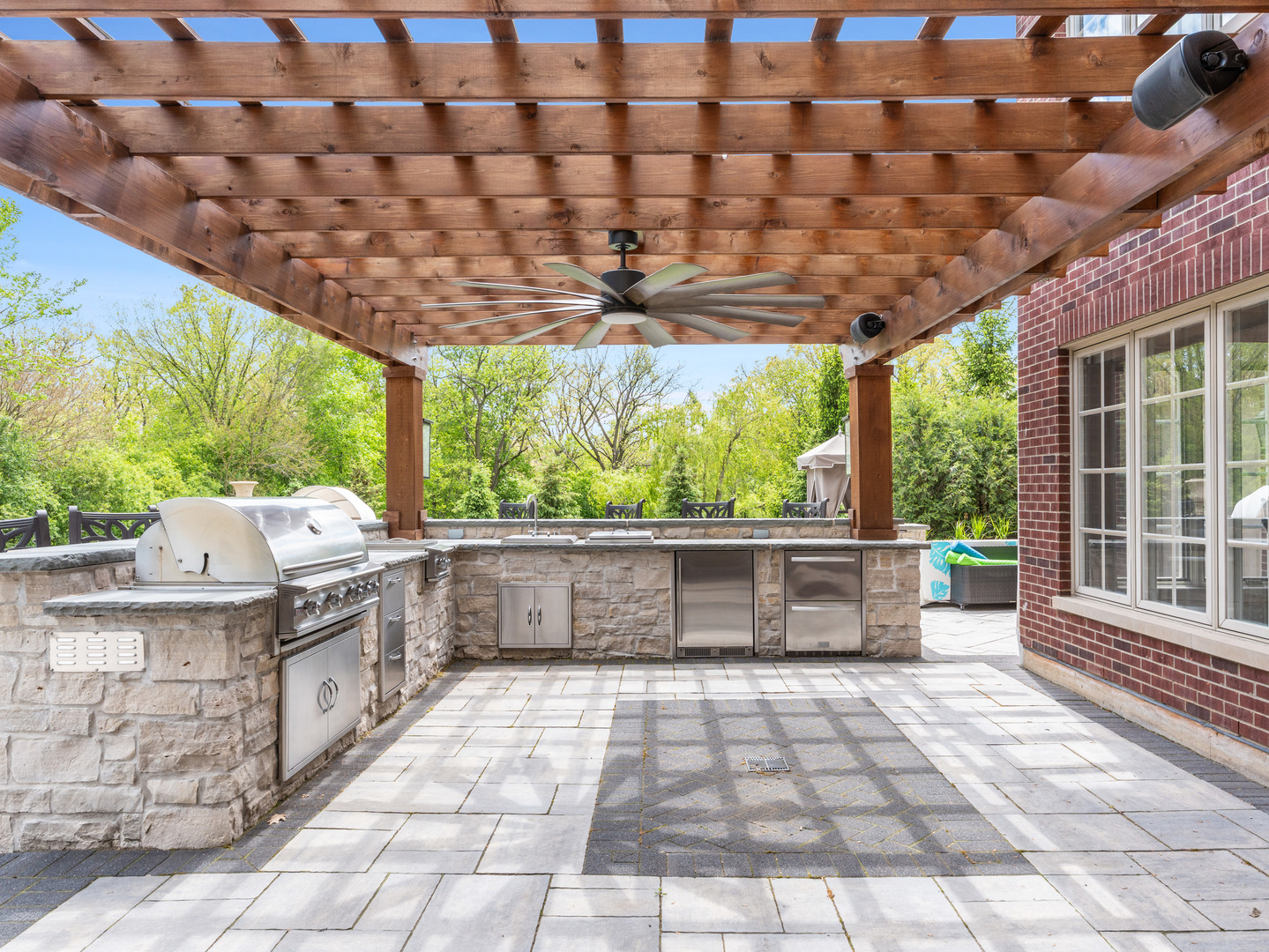 4N881 Old Farm Road St. Charles, IL 60175 - Photo 44 of 66 a view of a patio with a table and chairs in front of a yard