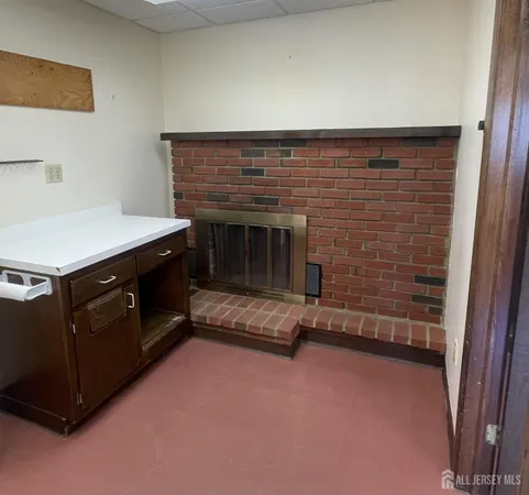 a workspace with furniture and book shelf