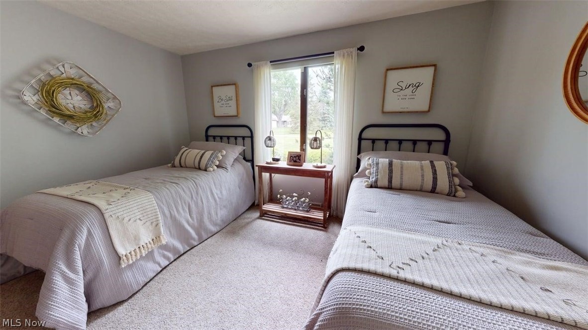 3985 Wiers Road Willard, OH 44890 - Photo 35 of 50 Neutral-toned bedroom featuring wall-to-wall carpeting and light gray walls