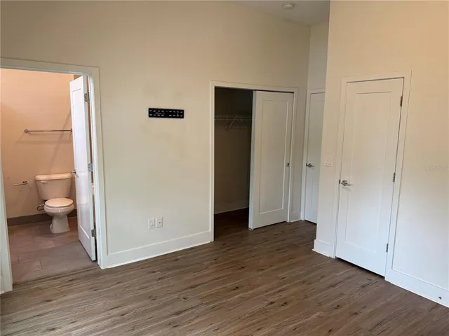 a view of a bathroom from a bathroom with a toilet