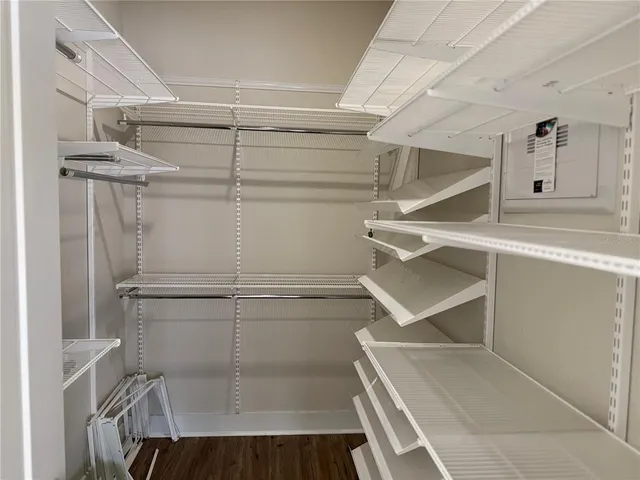 a view of a livingroom with a flat screen tv and wooden floor