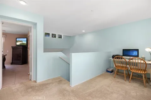 a workspace with furniture and window