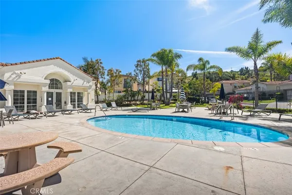 an aerial view of a house with a swimming pool