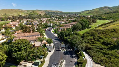 an aerial view of residential house with parking space and mountain view