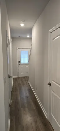 a view of a hallway with closet