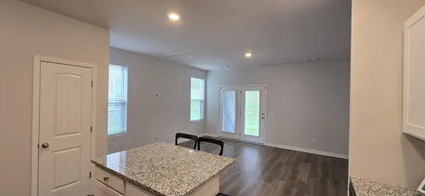 a view of kitchen and hall with a window