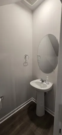 a bathroom with a sink and mirror