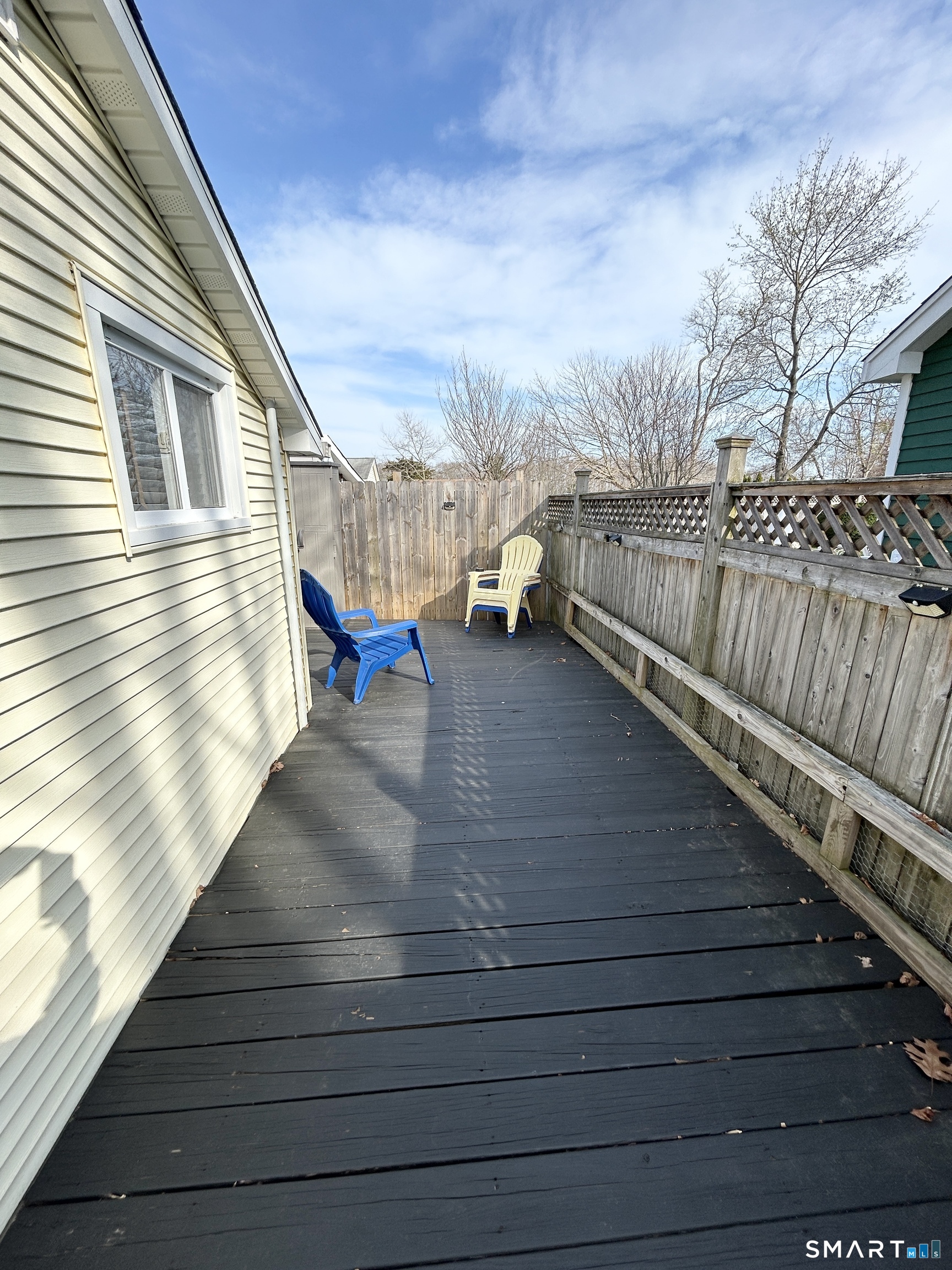 7 3rd Street, Unit 7 Madison, CT 06443 - Photo 40 of 44 a view of a balcony with wooden floor