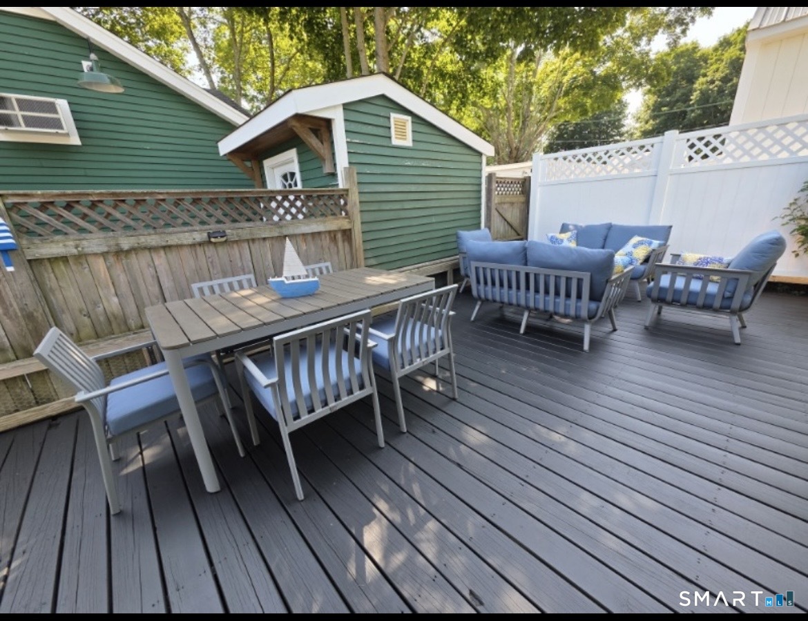 7 3rd Street, Unit 7 Madison, CT 06443 - Photo 41 of 44 a view of a chairs on wooden deck