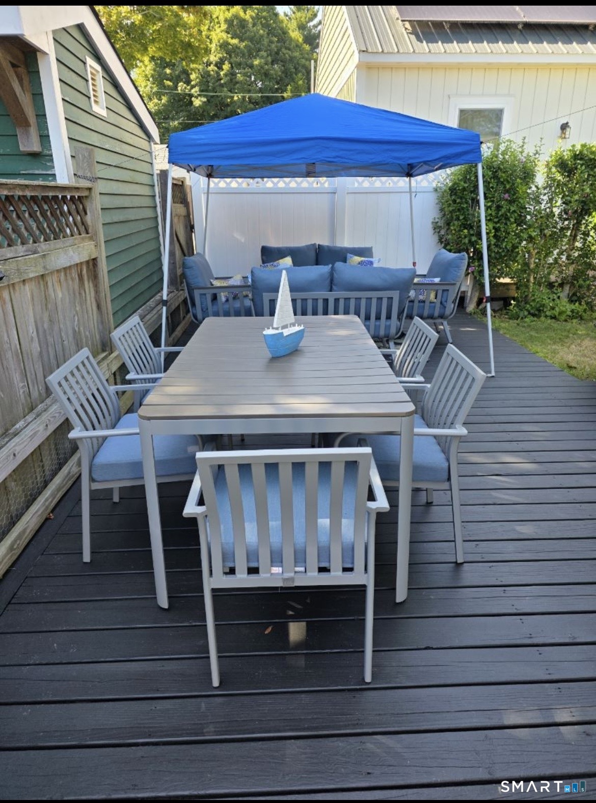 7 3rd Street, Unit 7 Madison, CT 06443 - Photo 43 of 44 a view of backyard with outdoor seating a patio and plants