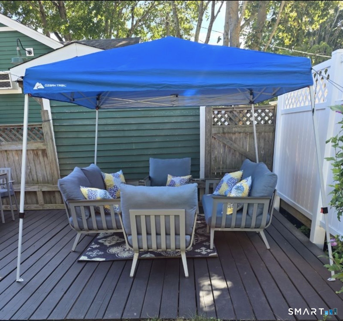 7 3rd Street, Unit 7 Madison, CT 06443 - Photo 44 of 44 a view of deck with table and chairs and wooden floor
