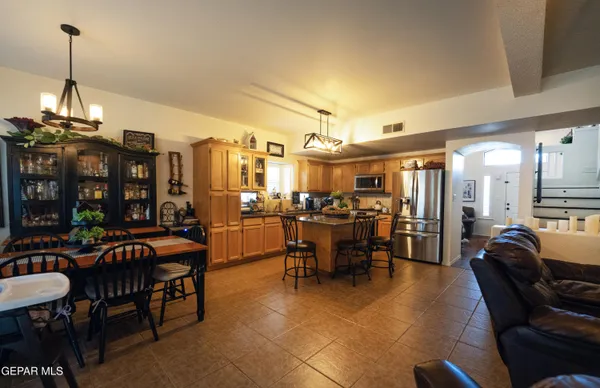 a view of a hallway with wooden floor and furniture
