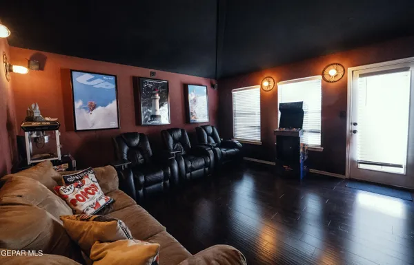 a spacious bathroom with a granite countertop sink mirror and toilet