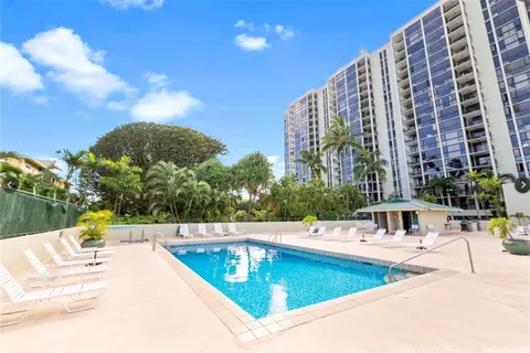 a view of a swimming pool with a lounge chairs