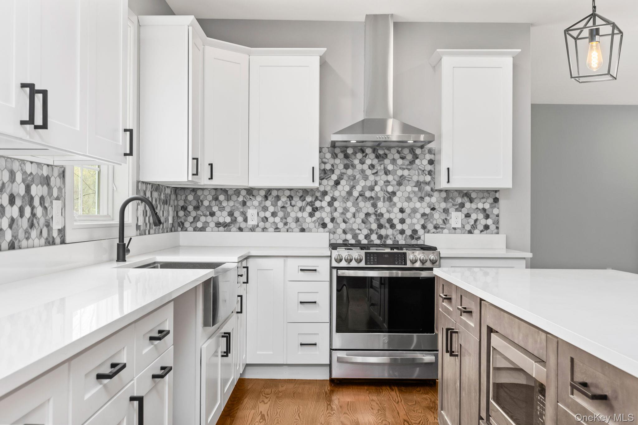 194 South Road Holmes, NY 12531 - Photo 11 of 19 Photo shown depicts recently completed sister home. Subject to change. Set allowance for kitchen cabinetry, countertops and kitchen appliances to be provided by seller. This photo demonstrates upgrades by buyers (at additional expense) including backsplash, appliances and lighting.