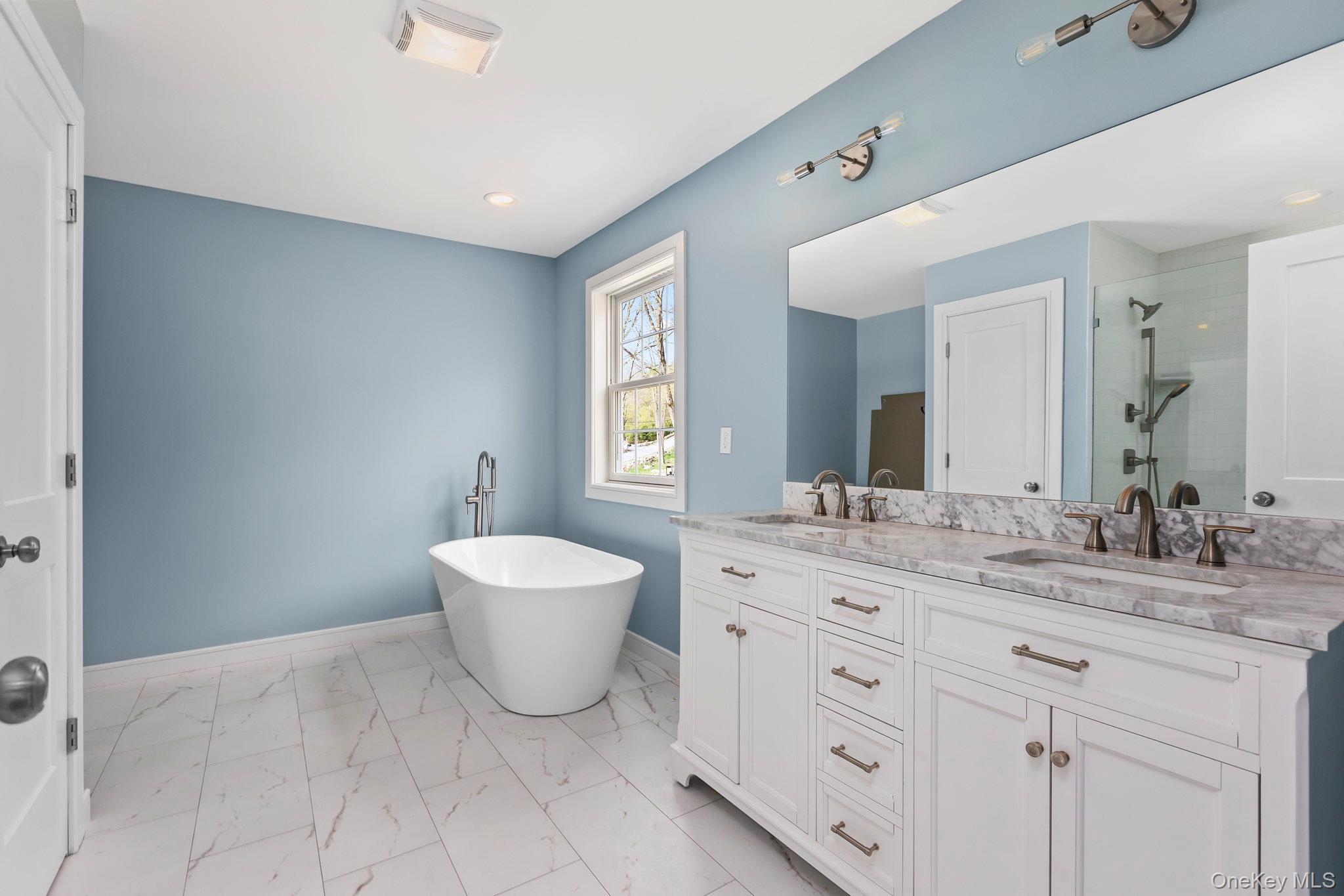 194 South Road Holmes, NY 12531 - Photo 13 of 19 Photo depicts bathroom completed for sister house. Primary will include dual vanities, stand alone tub and separate glass shower. Finishes can vary from sister house photo. Set allowance for bathroom will be given by seller.