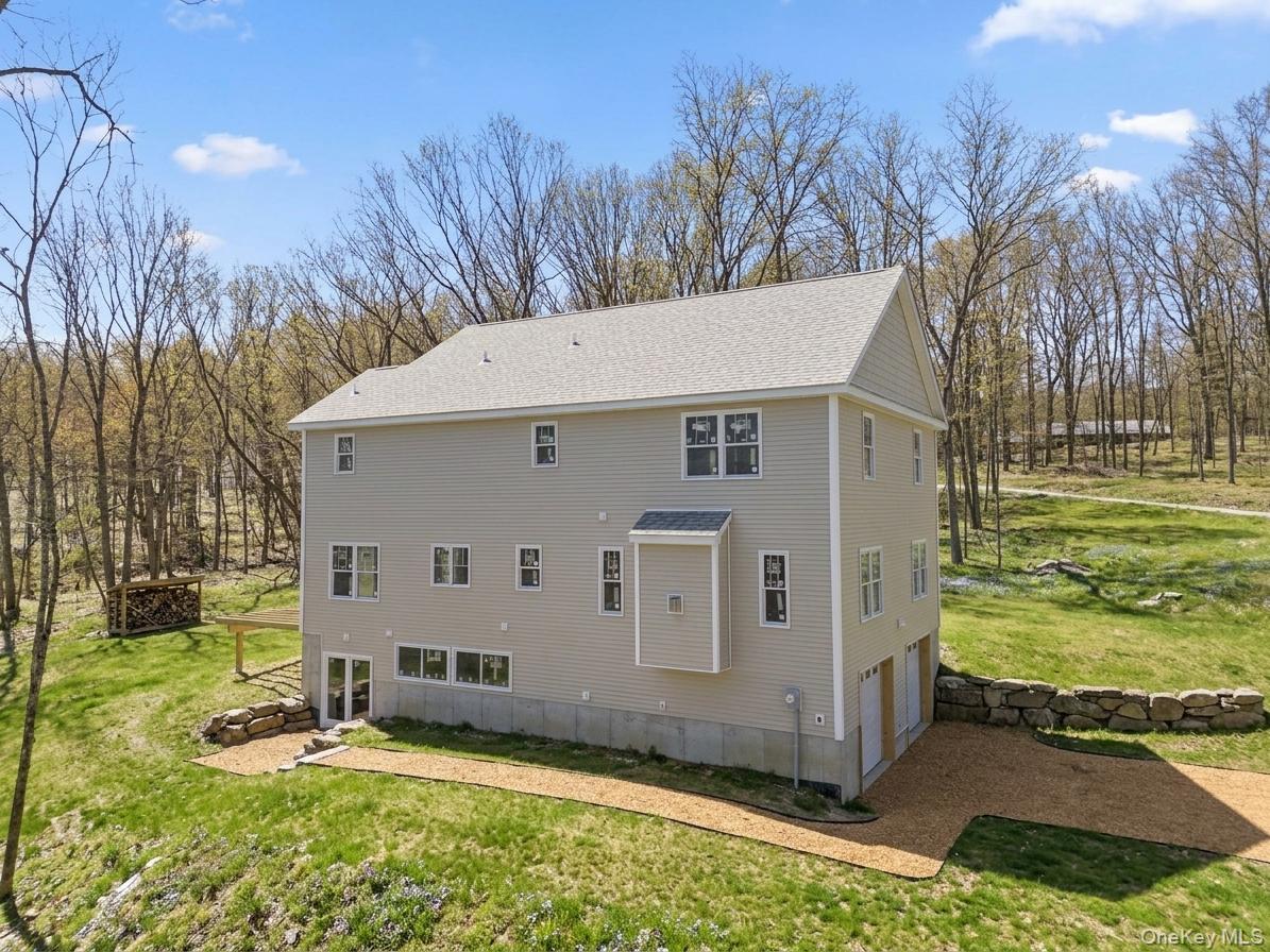 194 South Road Holmes, NY 12531 - Photo 3 of 17 a view of a white house with a big yard and large trees