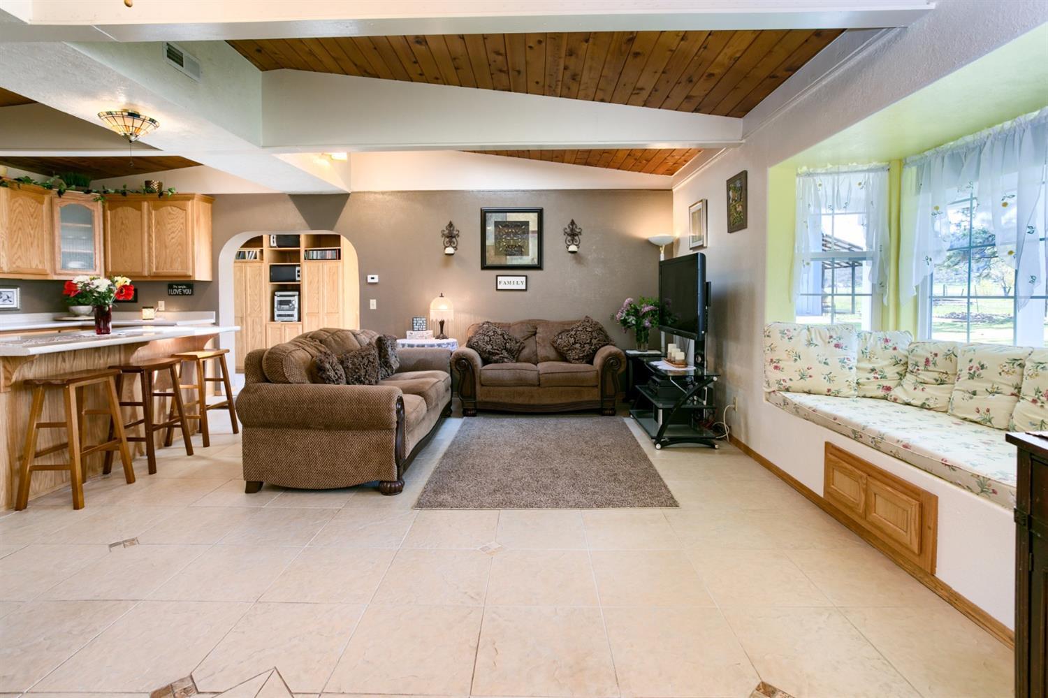 2777 East Antelope Road Eagle Point, OR 97524 - Photo 22 of 35 a living room with furniture and a fireplace
