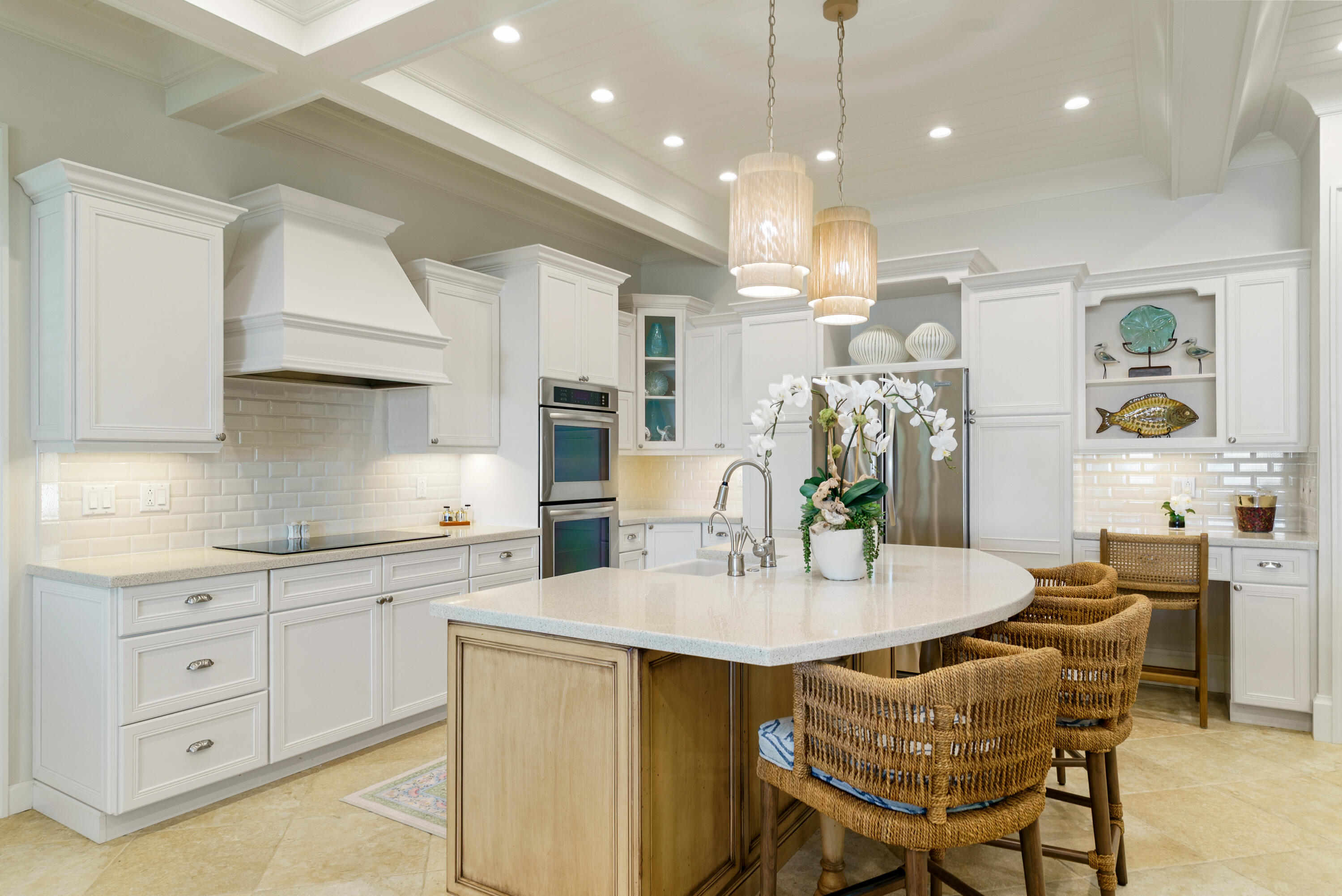 134 North Rolling Hill Road Tavernier, FL 33070 - Photo 16 of 65 a kitchen with stainless steel appliances kitchen island granite countertop a table chairs and white cabinets