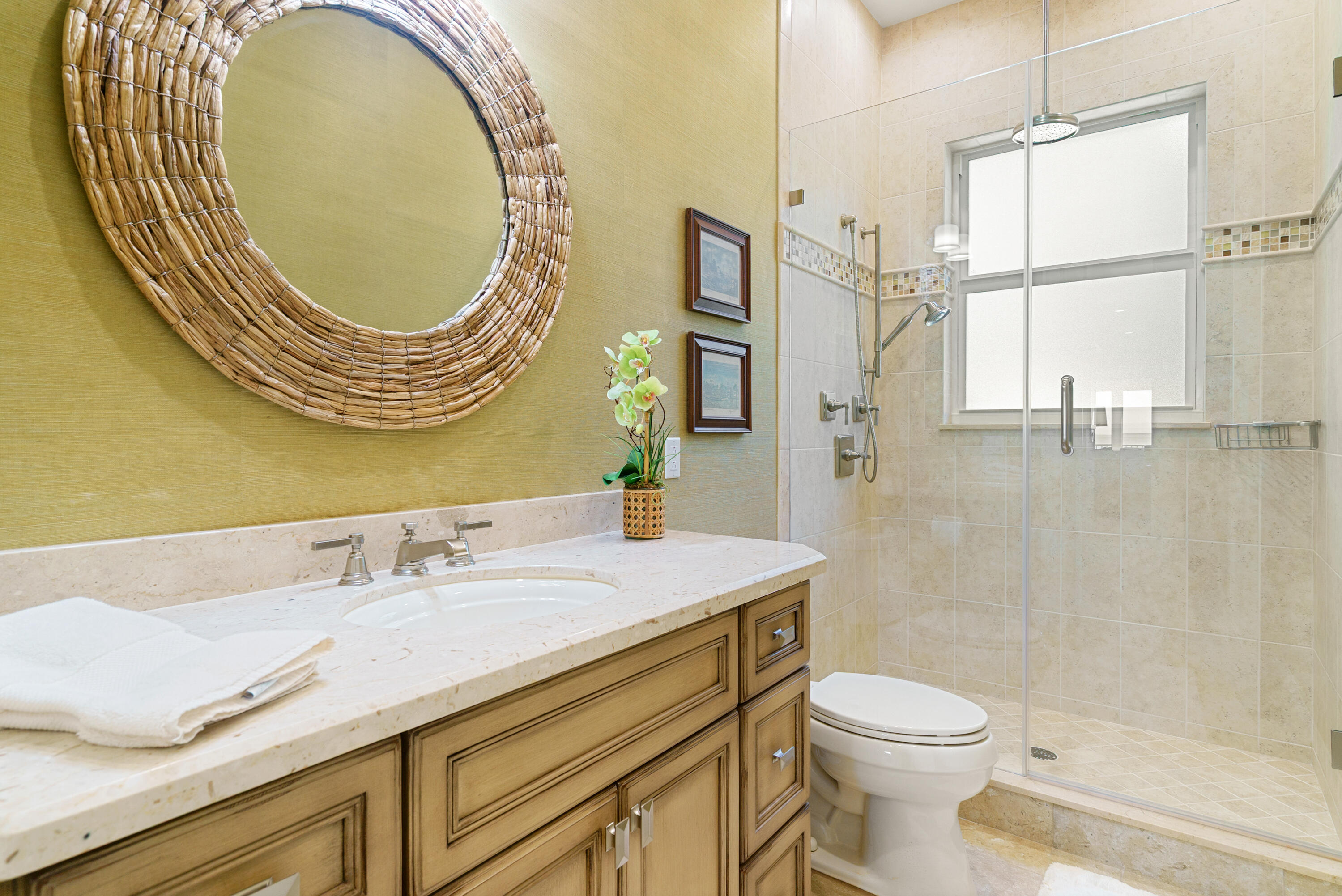 134 North Rolling Hill Road Tavernier, FL 33070 - Photo 37 of 65 a bathroom with a sink a toilet and a mirror