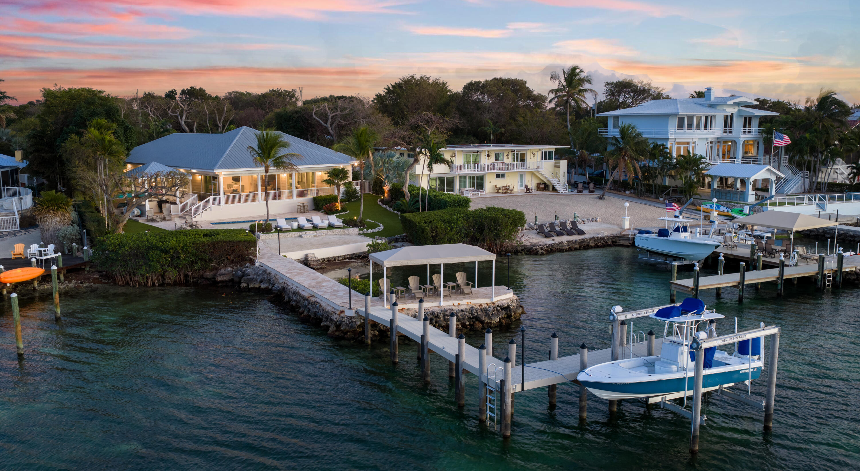 134 North Rolling Hill Road Tavernier, FL 33070 - Photo 54 of 65 a view of houses with water yard and outdoor seating