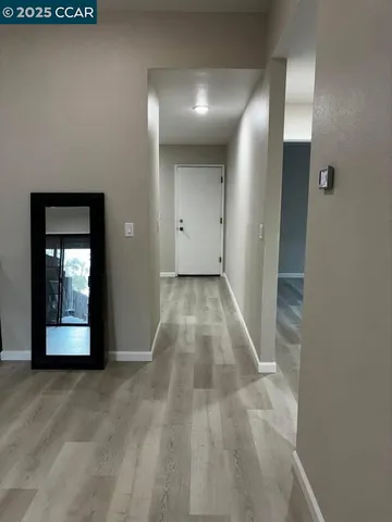 a white toilet sitting next to a bath tub