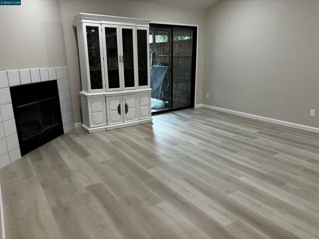 a room with a refrigerator and a sink