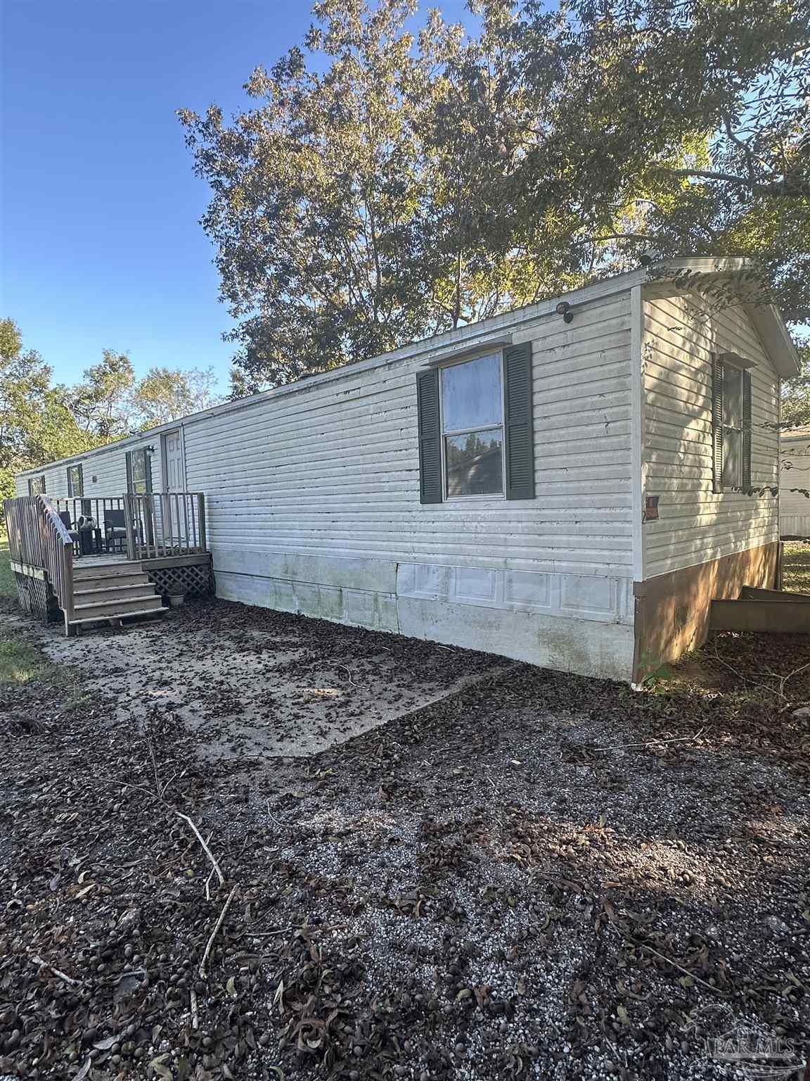 2866 Pine Forest Road, Unit 7 Cantonment, FL 32533 - Photo 1 of 17 a view of a backyard