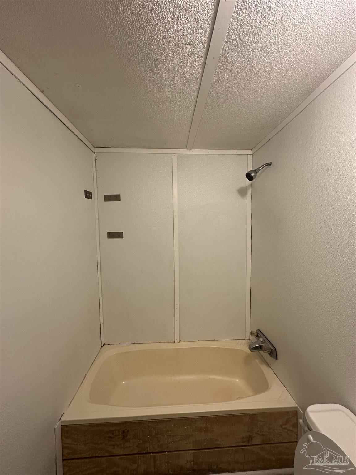 2866 Pine Forest Road, Unit 7 Cantonment, FL 32533 - Photo 8 of 17 a bathroom with a tub and shower