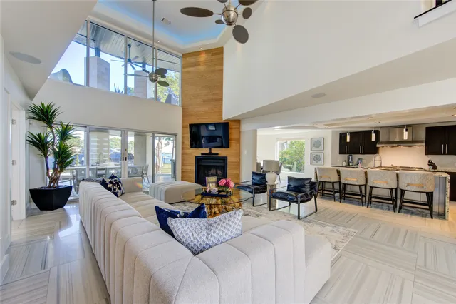 a bedroom with furniture and a large window