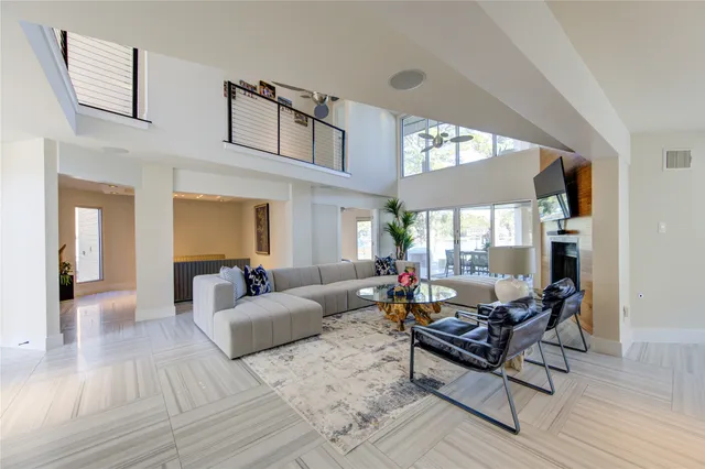 a living room with furniture and a lamp