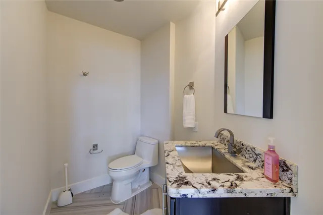 a spacious bedroom with a bed and a flat screen tv