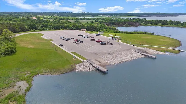 an aerial view of a house with a ocean view
