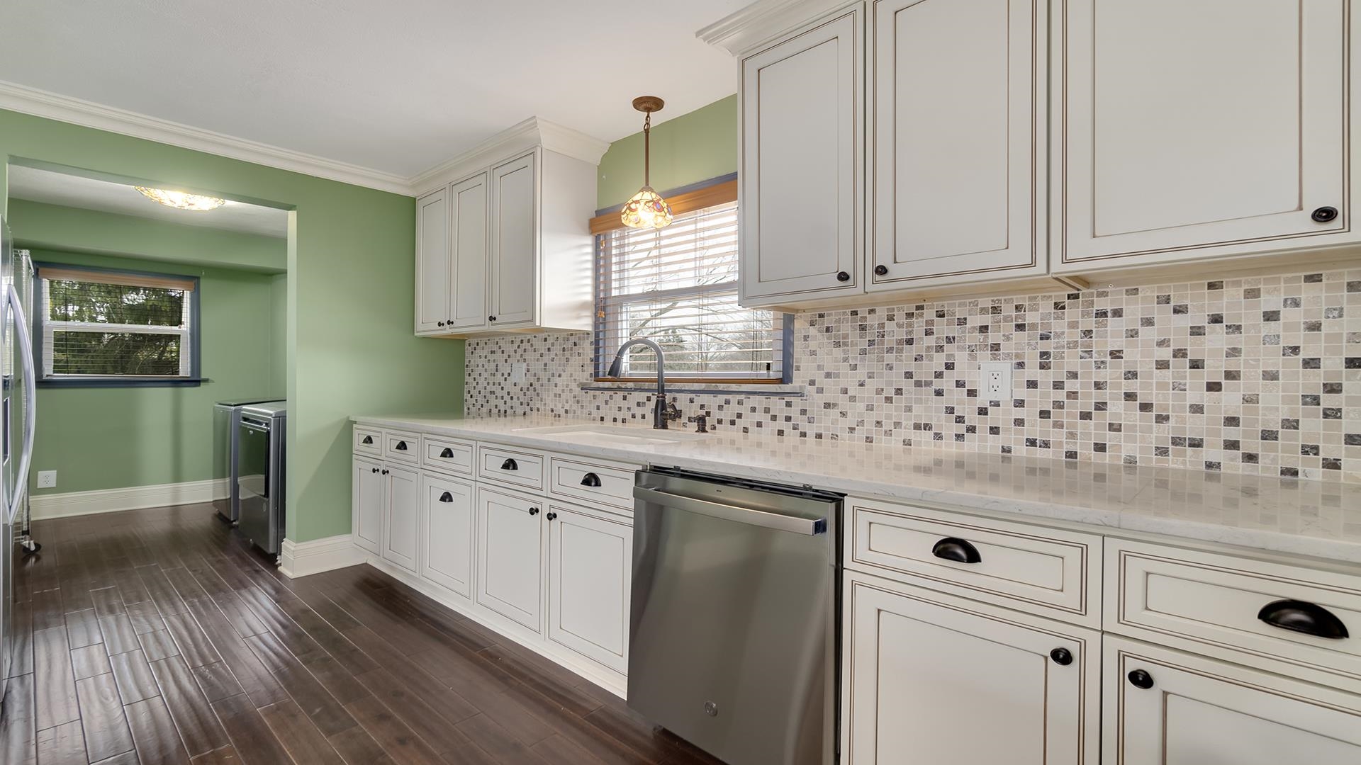 3927 Mill Road Cherry Valley, IL 61016 - Photo 14 of 36 a kitchen with granite countertop white cabinets and white appliances