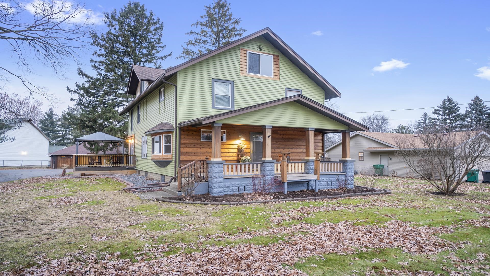 3927 Mill Road Cherry Valley, IL 61016 - Photo 2 of 36 a front view of a house with garden