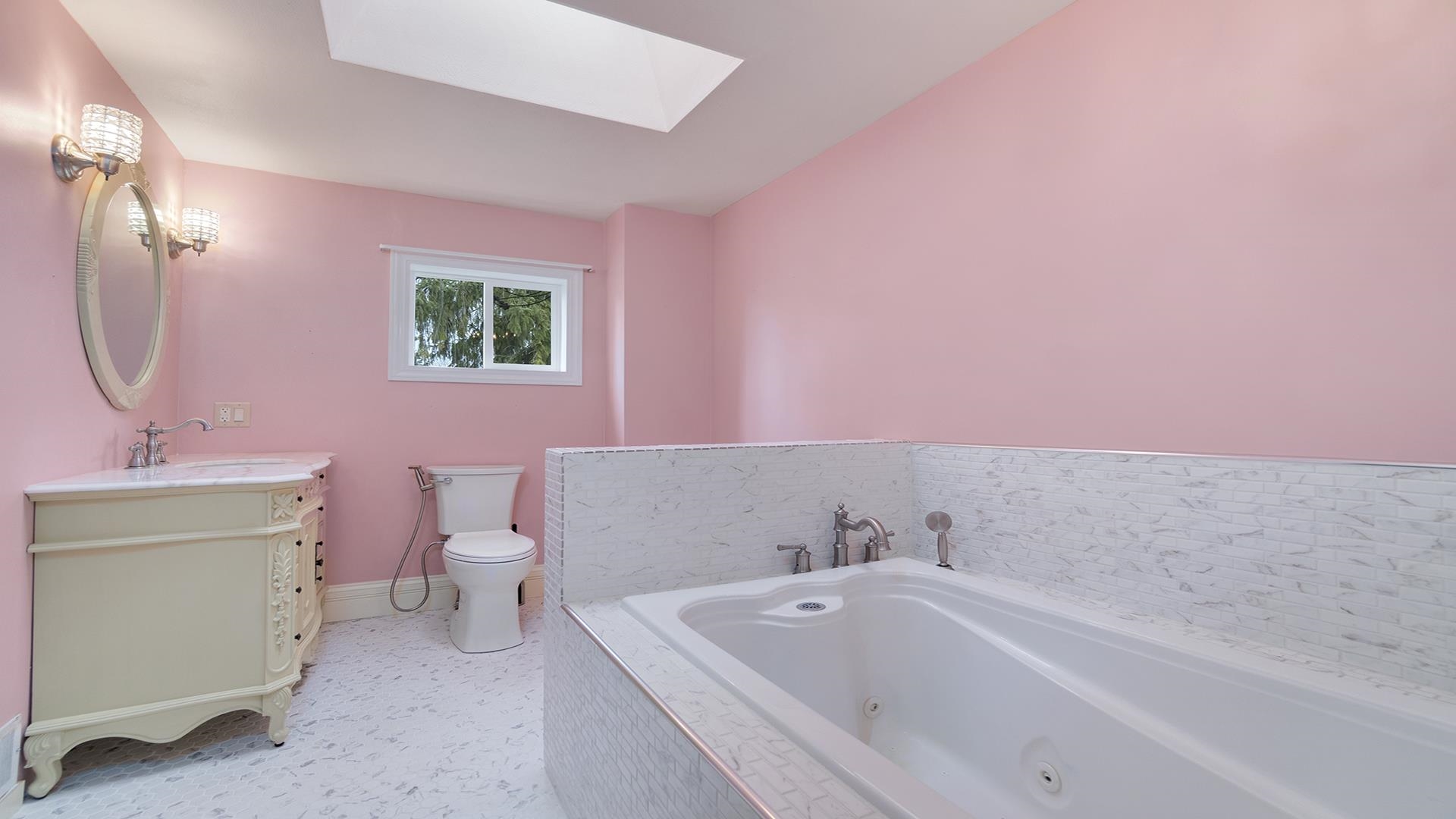3927 Mill Road Cherry Valley, IL 61016 - Photo 21 of 36 a bathroom with a sink mirror and a bath tub