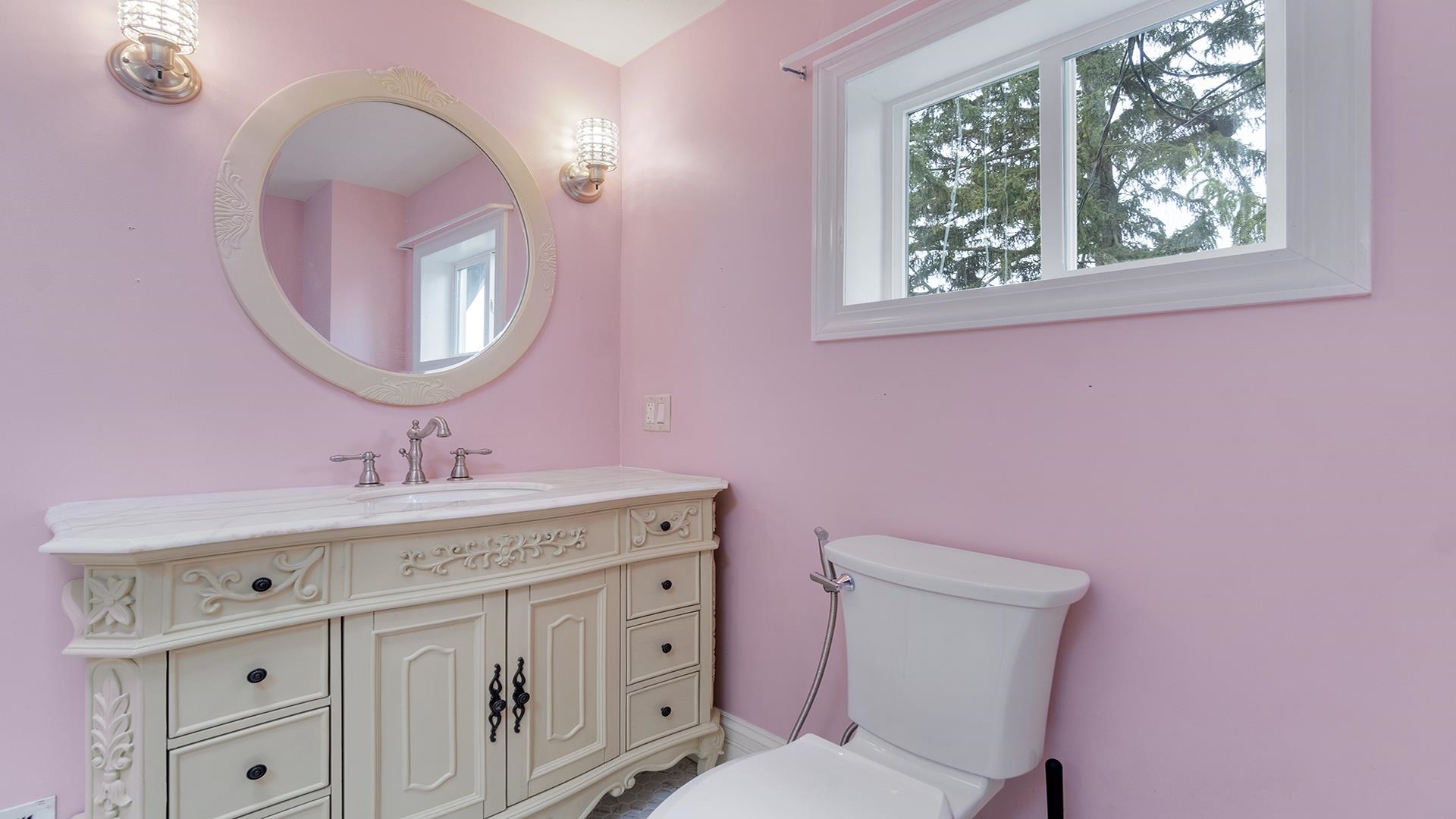 3927 Mill Road Cherry Valley, IL 61016 - Photo 23 of 36 a bathroom with a sink vanity mirror and toilet