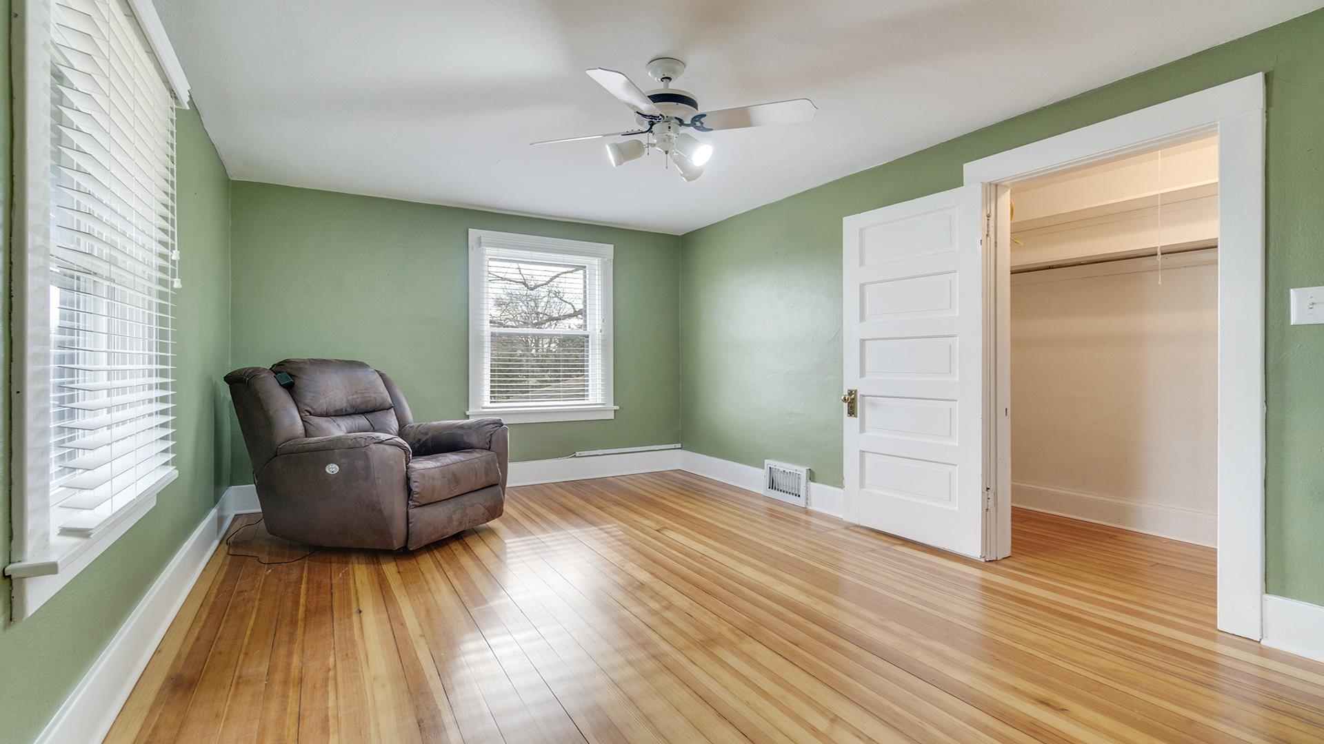 3927 Mill Road Cherry Valley, IL 61016 - Photo 26 of 36 a living room with furniture and a wooden floor