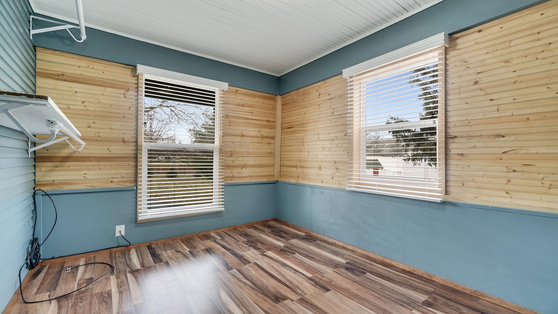 3927 Mill Road Cherry Valley, IL 61016 - Photo 28 of 36 a view of a room that has a window and wooden floor