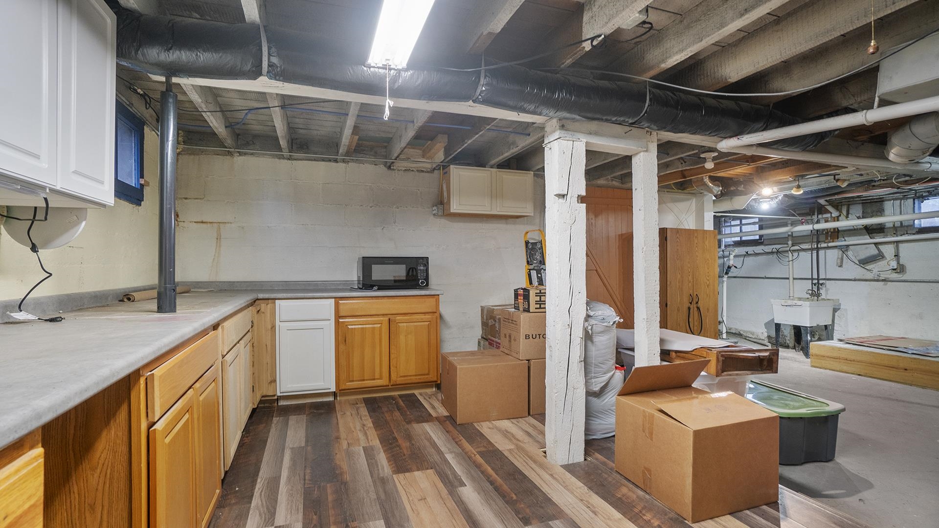 3927 Mill Road Cherry Valley, IL 61016 - Photo 30 of 36 a kitchen with stainless steel appliances granite countertop a sink and wooden cabinets