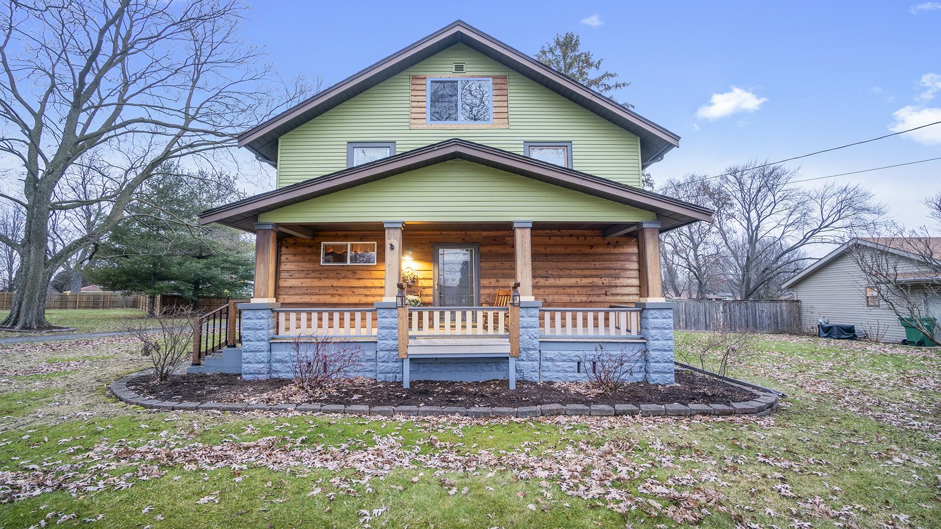 3927 Mill Road Cherry Valley, IL 61016 - Photo 3 of 36 a front view of a house with a yard and porch