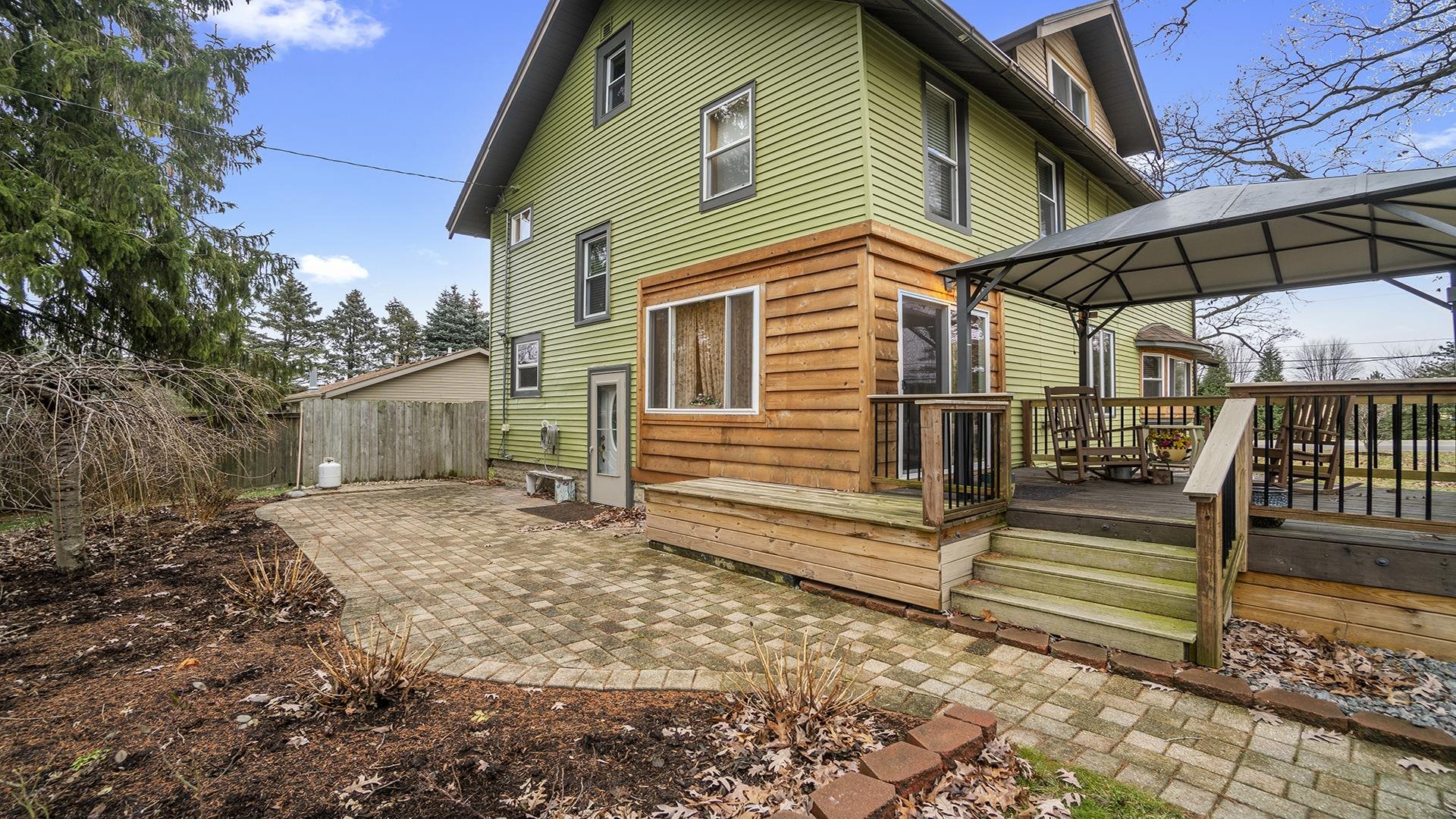 3927 Mill Road Cherry Valley, IL 61016 - Photo 33 of 36 a view of a house with a yard and wooden fence