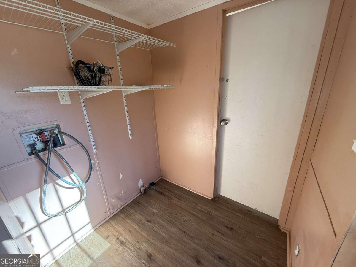 129 Elza Drive Cleveland, GA 30528 - Photo 12 of 14 a view of empty room with wooden floor and fan