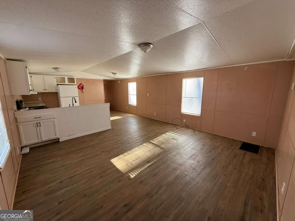 129 Elza Drive Cleveland, GA 30528 - Photo 2 of 14 a large hall with wooden floor