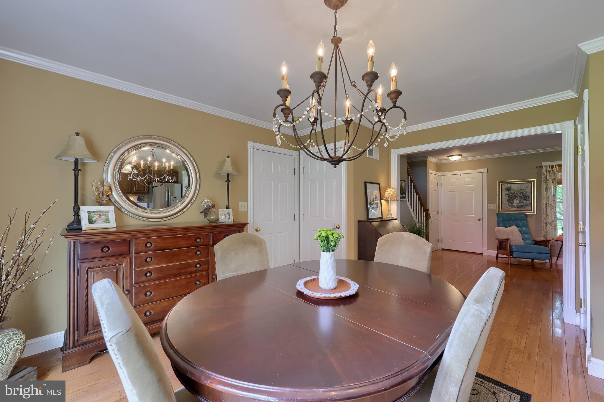 15 Sunrise Drive Lititz, PA 17543 - Photo 11 of 35 a view of a dining room with furniture a chandelier and wooden floor