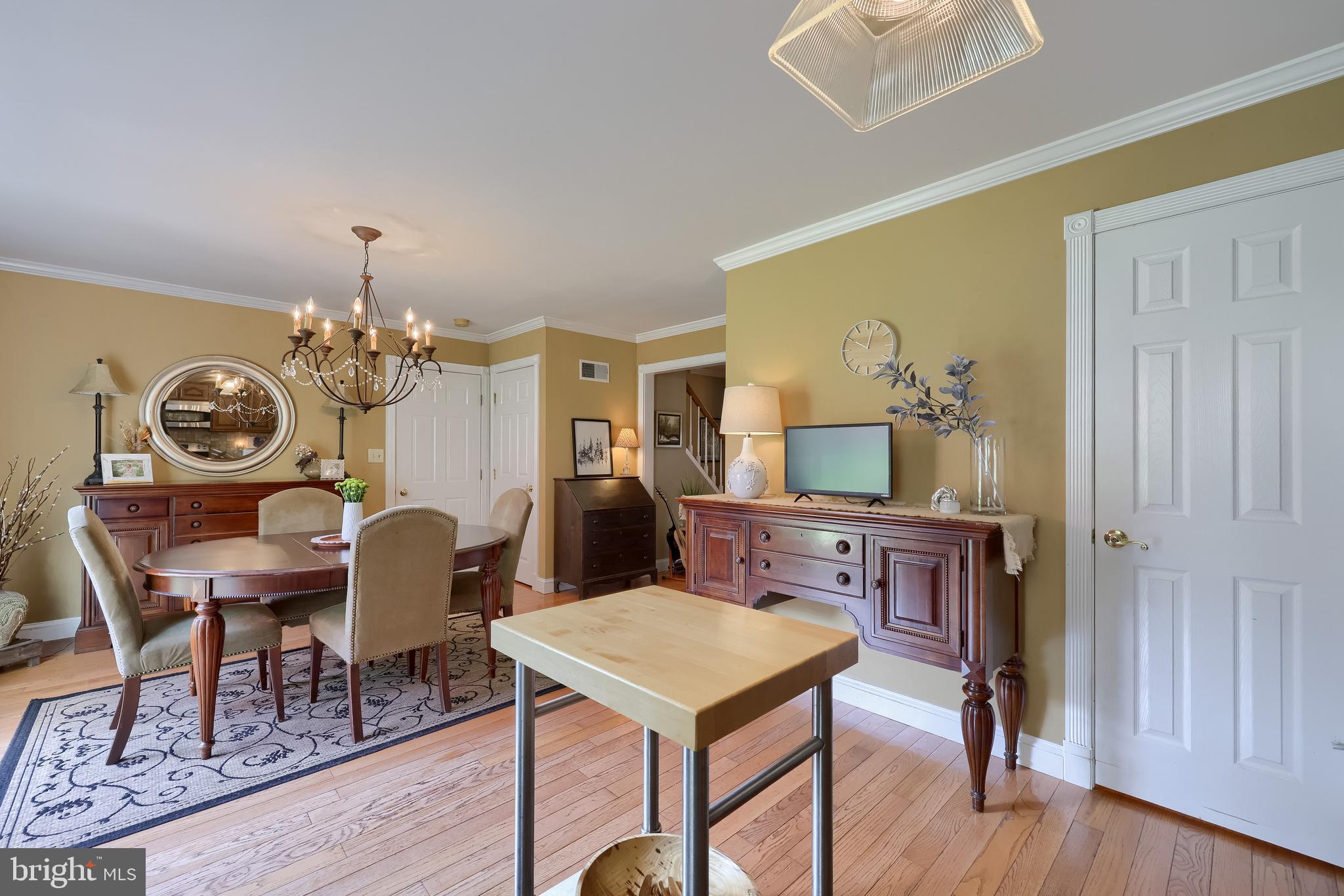 15 Sunrise Drive Lititz, PA 17543 - Photo 17 of 35 a view of a dining room with furniture a chandelier and wooden floor