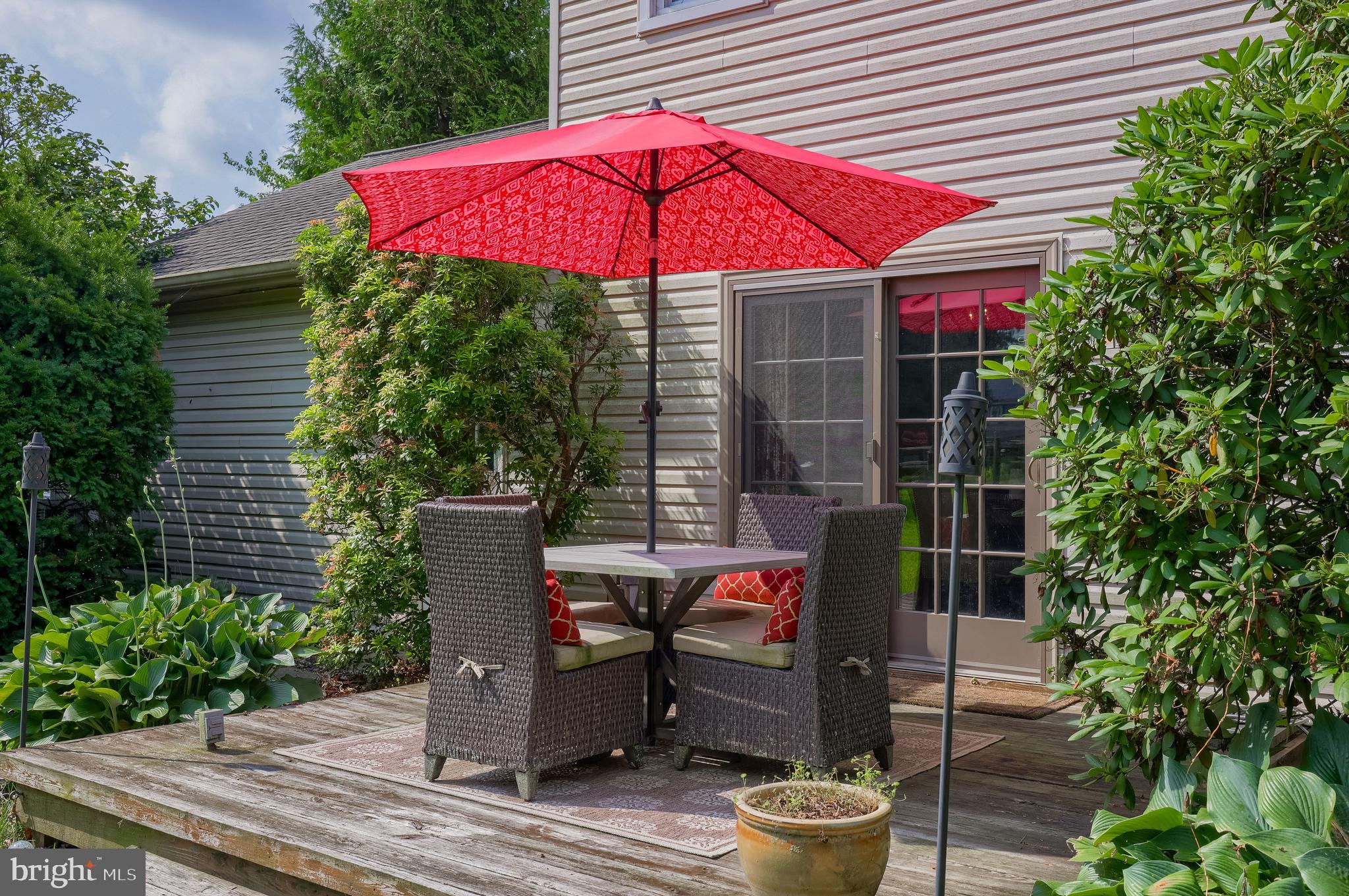 15 Sunrise Drive Lititz, PA 17543 - Photo 34 of 35 a patio with wooden benches and a potted plant