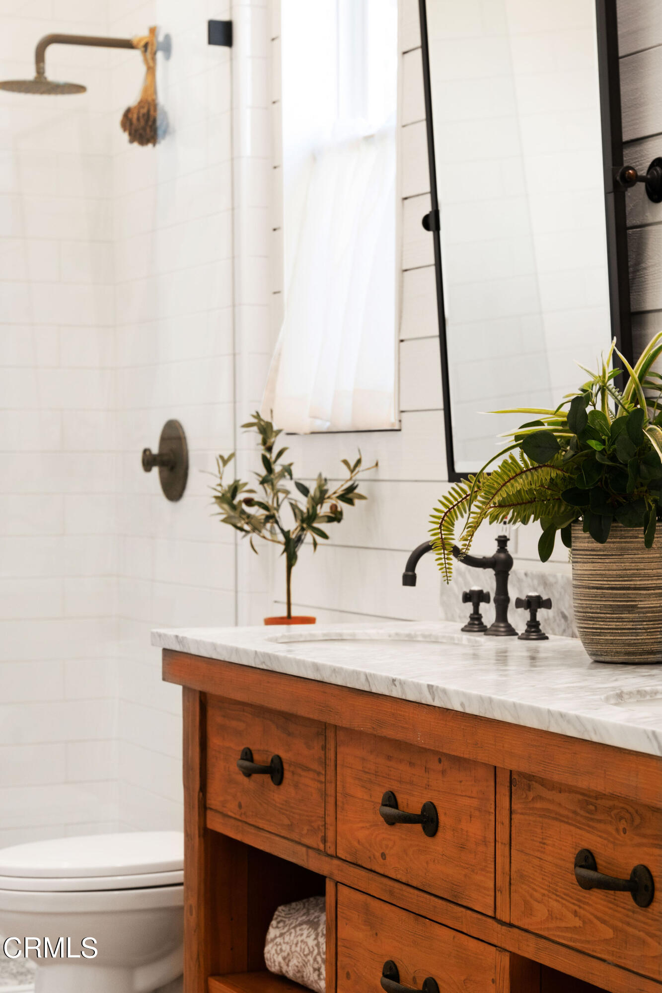 2050 Freeborn Way Camarillo, CA 93012 - Photo 28 of 61 a bathroom with a sink and a mirror