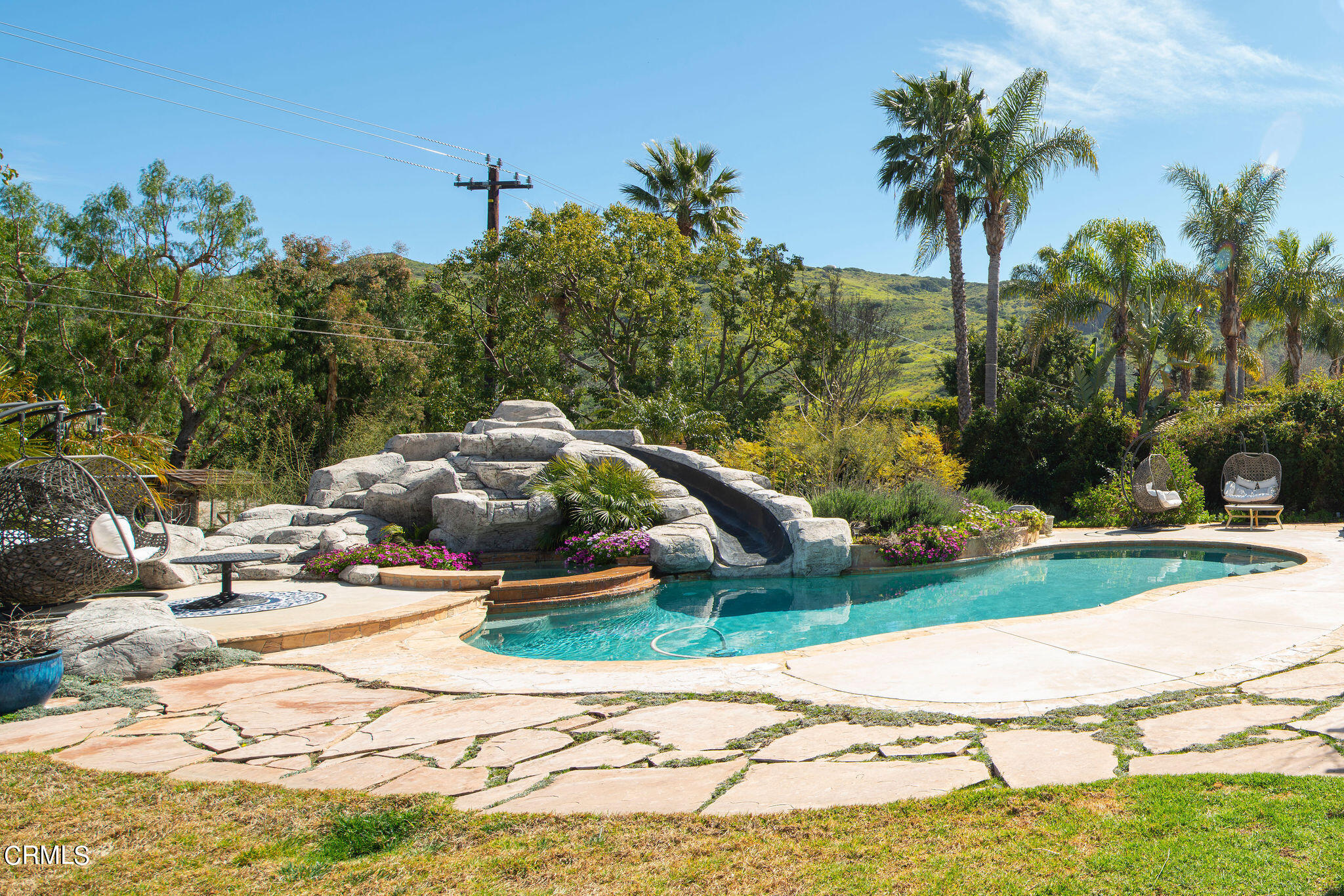 2050 Freeborn Way Camarillo, CA 93012 - Photo 49 of 61 a swimming pool with lots of tress in front of it